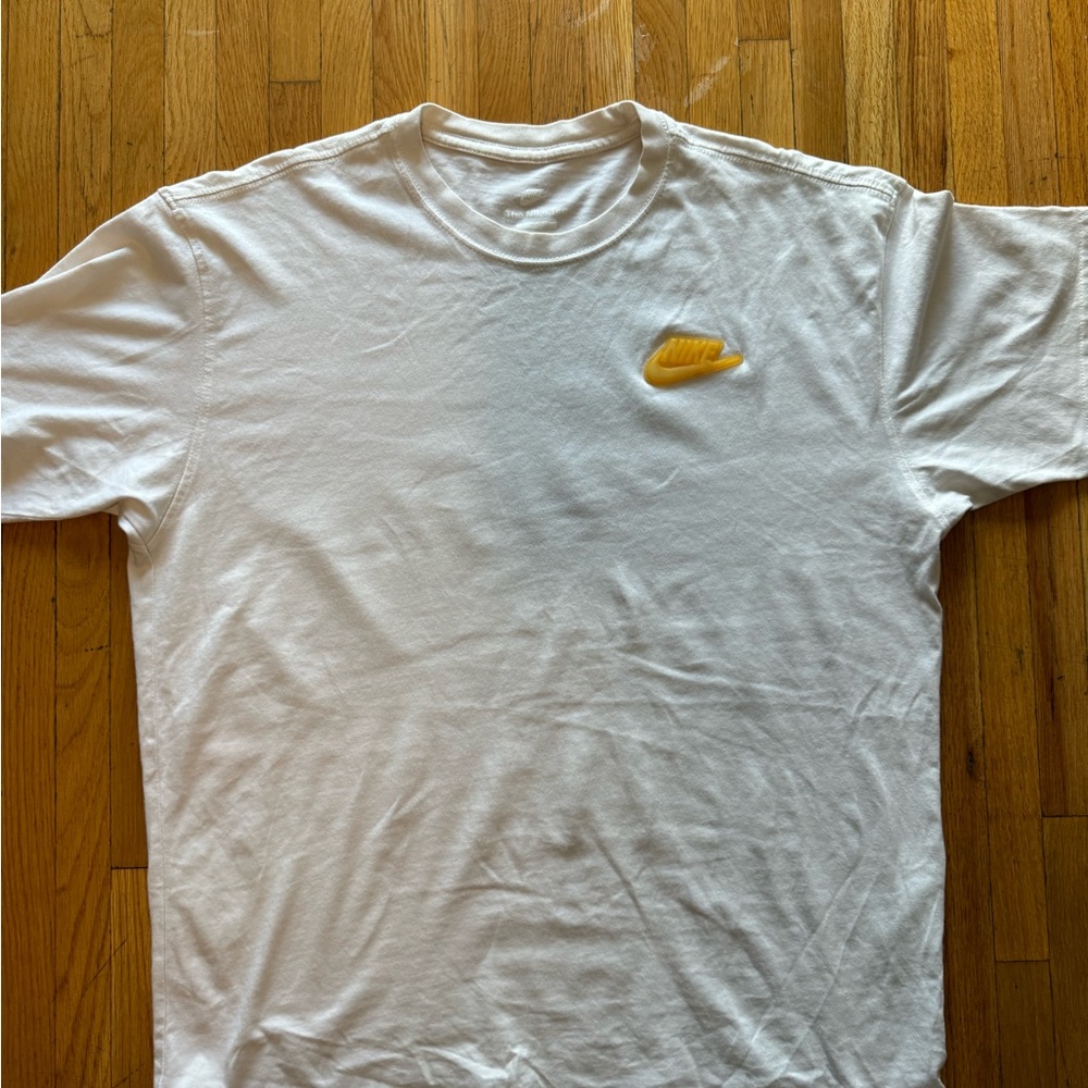 Nike White Tee with Gold Swoosh